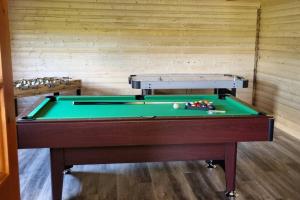 a pool table in a room with a wall at Grace's Place with Hot Tub & Games Room in Carrickfergus