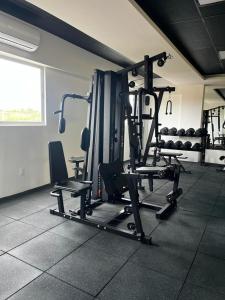 a room with a gym with several tread machines at Studio no West Fit Mossoró Alto Padrão in Mossoró