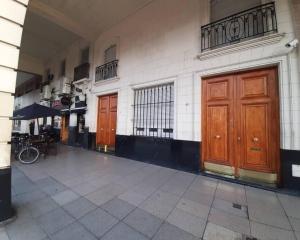 a building with two brown doors on the side of it at Libertador recoleta in Buenos Aires