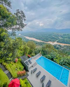 an aerial view of the house with a swimming pool at Mount Blue Kandy in Kandy