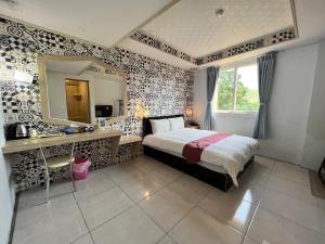 Postel nebo postele na pokoji v ubytování Dajenshan Hotel