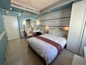 Katil atau katil-katil dalam bilik di Dajenshan Hotel