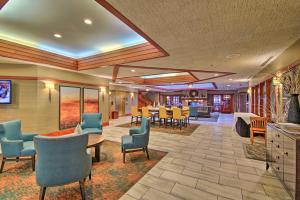 a large lobby with chairs and a dining room at Updated Retreat with Golf Course and Wildlife Views! in Galena