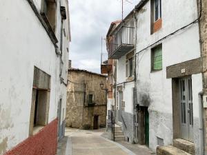 an alley in an old town with buildings at Holiday Home in Villamiel with Mountain Views in Villamiel