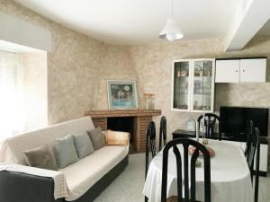 a living room with a couch and a fireplace at Holiday Home in Villamiel with Mountain Views in Villamiel +32 photos