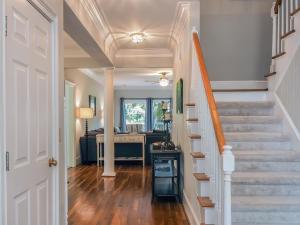 a hallway of a home with stairs and a desk at 2873 Hidden Oak Drive in Seabrook Island