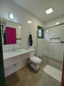 a bathroom with a sink and a toilet and a shower at Recanto Serra do Trovão in Ouro Preto