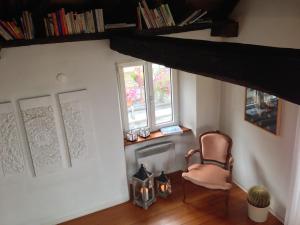 a room with a chair and a window at Casa don Bosco in Locarno