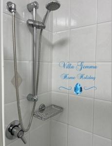a shower in a bathroom with the words nintendo gamma homeadium at Villa Gemma in Campomarino