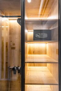 a sauna with wooden shelves and a microwave at Sky Residence Split in Split