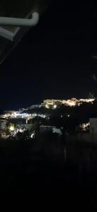 a view of a city at night with lights at La Casa al Mare in Peschici