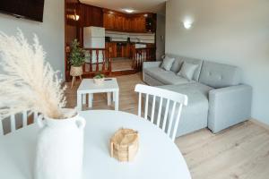 a living room with a couch and a table at LAR DA REVOLTA in Cedeira