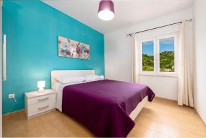 Posteľ alebo postele v izbe v ubytovaní Apartments Mirjana Mljet