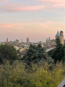 a view of a city with trees and buildings at App di Myrò in Reggio Emilia