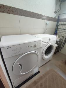 a white washer and dryer in a room at Sarajevo Paradise in Sarajevo