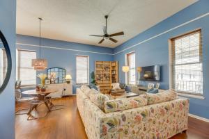 a living room with blue walls and a couch at Renovated San Marcos Vacation Rental with Balcony! in San Marcos