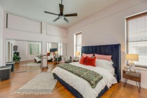 a bedroom with a large bed and a ceiling fan at Renovated San Marcos Vacation Rental with Balcony! in San Marcos