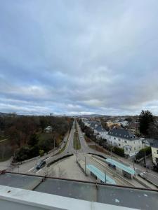 a view of a city with a bridge over a road at Frognervein Terrace Penthouse in Oslo