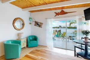 a living room with a view of the ocean at Saylor's Bay in Key Colony Beach