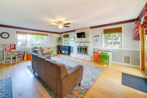 a living room with a couch and a fireplace at Vancouver Vacation Rental about 16 Mi to Portland! in Vancouver