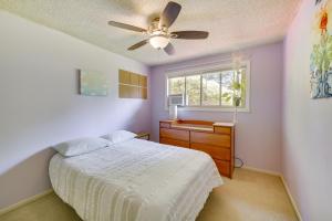 a bedroom with a bed and a ceiling fan at Vancouver Vacation Rental about 16 Mi to Portland! in Vancouver