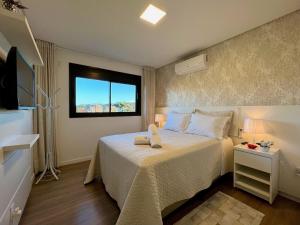 Ένα ή περισσότερα κρεβάτια σε δωμάτιο στο Apartamento Volo Class 1 dorm Centro by Achei