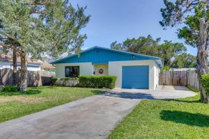 a house with a blue garage in a yard at Florida Vacation Rental Near Historic Downtown in Saint Augustine