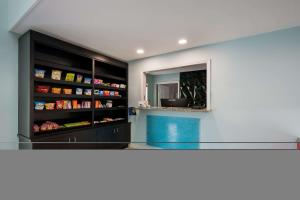 a kitchen with a glass counter and a mirror at Quality Inn Oxford Anniston I-20 in Oxford