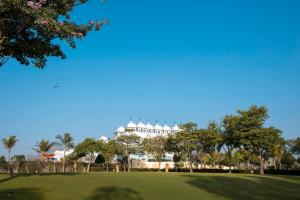 a view of the resort from the park at Radisson Blu Udaipur Palace Resort & Spa in Udaipur