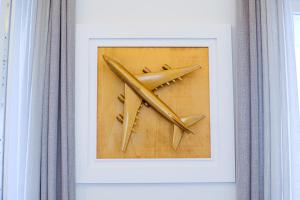 a picture of a picture of an airplane in a frame at Dolcevita Boutique Apartment in Florence +25 photos
