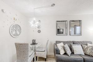 a living room with a couch and a table at Bluewater Resort 816 in Myrtle Beach