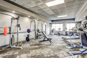 a gym with treadmills and machines in a room at Bluewater Resort 816 in Myrtle Beach