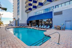a swimming pool in front of a building at Bluewater Resort 816 in Myrtle Beach