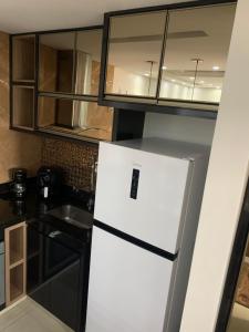 Kuchyň nebo kuchyňský kout v ubytování Flat Master com Hidromassagem privativa e piscina 500mts praia