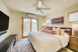 a bedroom with a bed and a ceiling fan at Casita Tres Hermanos in Santa Fe