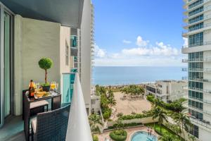 a view of the ocean from the balcony of a resort at Extraordinary Oceanfront Condo - Heated Pool, Gym and Game Room - Hollywood Beach in Hollywood