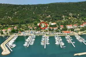 an aerial view of a marina with boats in the water at Apartments by the sea Supetarska Draga - Gornja, Rab - 21380 in Rab
