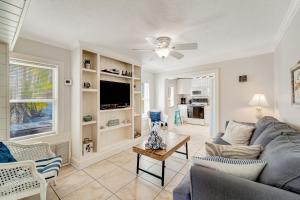 a living room with a couch and a tv at Casa Del Sol B in Bradenton Beach
