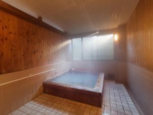 Postel nebo postele na pokoji v ubytování Ryokan Tamagoyu