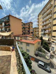 a car parked in a parking lot next to buildings at StabiaSummer in Castellammare di Stabia