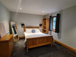 a bedroom with a bed and a window at Woodview House in Elgin