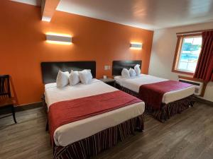 Postel nebo postele na pokoji v ubytování Colonel Williams Resort and Suites + 36 fotografií