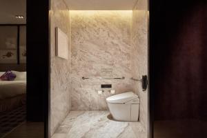 a bathroom with a toilet in a room at W Guangzhou in Guangzhou