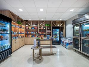 a restaurant with a refrigerator and a table in a room at Staybridge Suites Chicago O'Hare - Rosemont by IHG in Rosemont +104 photos
