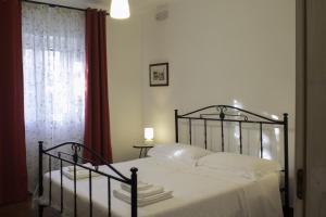 Un ou plusieurs lits dans un hébergement de l'établissement Villa Apollonia B&B