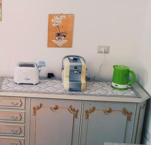a kitchen counter with appliances on top of it at Agape casa vacanze in Giardini Naxos +16 photos