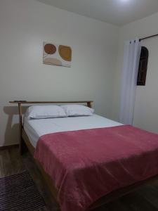 Postel nebo postele na pokoji v ubytování Recanto Casa Amarela