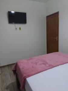 Postel nebo postele na pokoji v ubytování Recanto Casa Amarela