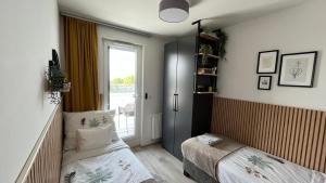 Postel nebo postele na pokoji v ubytování Top Design Apartment