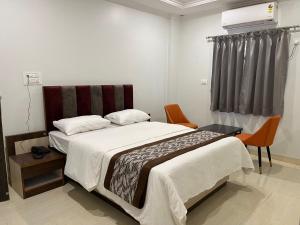 Postel nebo postele na pokoji v ubytování Hotel Jeet Paradise